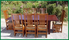 Set of eight side chairs around large table without leaves installed